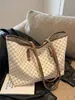 Bolso de mano sencillo y de gran capacidad para mujer, primavera 2025, nuevo bolso de mano de moda para ir al trabajo, bolso de hombro portátil de gran capacidad.