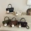 Bolsa de ombro elegante trançada para mulheres, nova moda outono 2026, bolsa transversal pequena versátil para o dia a dia