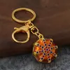 Llavero de estilo étnico con patrón octagonal, goteo de aceite e incrustaciones de diamantes, colgante de patrón vintage, regalo de recuerdo de viaje al por mayor