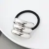 Estilo punk europeo y americano metal personalidad alta calidad cuerda para la cabeza semicírculo tubo redondo anillo para el pelo cuerda elástica para el pelo Balot fabricantes al por mayor