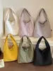 Bolsa tote de design transfronteiriço para mulheres, novo modelo primavera/verão 2026, bolsa de ombro de grande capacidade, bolsa de ombro moderna e de alta qualidade