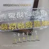 Decorações de nail art de estrela e cruz em grade de 12 compartimentos, populares para exportação e vendas transfronteiriças, paetês de rebite de metal, acessórios de strass para unhas DIY