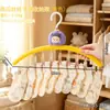 Cabide multifuncional em formato de boneca abóbora roxa com vários prendedores, varal antiderrapante para secar roupas íntimas e meias, suporte multifuncional para guardar roupas em casa.