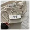Bolso pequeño de alta gama para mujer, nuevo 2026, lazo francés, bolso cuadrado pequeño para el trabajo, bolso versátil de un solo hombro cruzado