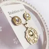 Nuevo especial transfronterizo explosión de tendencia europea y americana titanio acero alta calidad color collar pendientes traje femenino joyería de concha real