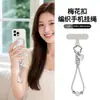 Alça de celular de flor de ameixa com fivela, best-seller transfronteiriço, pingente criativo em formato de coração, pulseira trançada, cordão de pulso anti-perda da moda europeia e americana