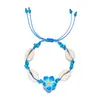 Directo de fábrica moda pequeña fresca flor de arcilla blanda concha pulsera tejida femenina joker cuerda de mano tejida a mano venta al por mayor