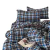 Juego de cuatro piezas de algodón lavado con gasa fruncida de cuadros simples Clase A, juego de tres piezas de gasa de doble capa a rayas de color liso estilo ins para dormitorios estudiantiles