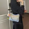 Bolso de axila tejido con paja de arcoíris transfronterizo para mujer, nuevo modelo 2026, bolso de hombro cruzado casual simple de nicho para la playa