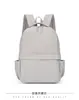 Mochila casual para hombres y mujeres, mochila impermeable de color liso, mochila escolar ligera de gran capacidad para estudiantes, mochila elegante para mujeres