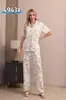 Pijama de Verão Novo Europeu e Americano Cruzado de Seda Leite Dupla Face Gola Reversível Manga Curta Calças Roupa de Casa para Mulheres Que Podem Ser Usadas Fora