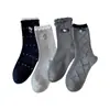 Calcetines grises para mujer con colgante de gato bordado de dibujos animados, lazo, longitud hasta la mitad de la pantorrilla, etiqueta de tela estilo coreano, encaje de lunares, calcetines apilados