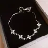 Pulsera Flor de Circonita Chapada en Oro Real Nicho Dulce Versátil Pulsera Temperamento Lujo Ligero Joyería de Gama Alta para Mujeres Al Por Mayor