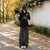Pantalones casuales de cuadros negros y grises para mujer 2026 otoño e invierno nuevo estilo caída baja estatura lana franela holgados rectos de pierna ancha