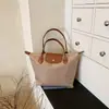 Bolso de Mano Estilo Coreano para Mujer 2026 Nuevo Diseño de Bloques de Color Bolso Tote para Mujer Moda de Nicho Bolso de Hombro de Gran Capacidad