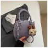 Bolsa de almohada transfronteriza para mujer 2026 Nuevo estilo Moda Popular Temperamento Bolsa de boliche Elegante Bolso de mano para hombro Cruzado Moderno
