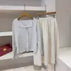 Adaptabilidad desde el Color Beige Diseño Suave, Falda de Retazos de Cintura Alta de Longitud Media Texturizada E018