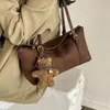 Gamuza 2026 Dibujos Animados Simple Bolso de Hombro Único para el Trabajo Moda Diaria Nuevo Coreano Terciopelo Colgante Bolso de Axila Otoño/Invierno Versátil