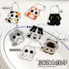 Nuevo llavero de gato de dibujos animados acrílico lindo gatito negro cadena de cuentas de marea nacional gatito colgante para mochila al por mayor