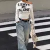 Sudadera Nueva de Otoño 2026 Estilo Vintage Americano con Hombros Descubiertos y Estampado de Letras para Mujer, Camiseta de Manga Larga Adelgazante y Versátil