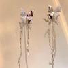 Pendientes de clip con borla de mariposa blanca brillante y diamantes, sin agujeros, diseño de nicho para mujer, personalizados, dulces, modernos y atractivos.