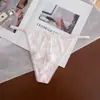 Nova Tanga Sexy de Cor Sólida Macia de Seda de Gelo para Mulheres de Cintura Baixa Sem Costura Divertida com Pom-Pom Fofa Calcinha T para Mulheres
