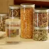 Frasco sellador de alimentos personalizado, botella de plástico redonda transparente PET, botella para envasado de frutos secos para artículos de Año Nuevo, botella selladora para envasado de té de flores