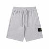 Shorts de Cinco Pontos Europeus e Americanos Transfronteiriços New Stone Stone Cor Sólida Manga Bússola para Homens e Mulheres com Decoração de Bolso Grande