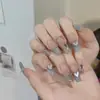 Armadura de mano sentido avanzado hecho a mano ins explosiones diamante roto mariposa uña piezas de uña al por mayor uñas portátiles