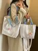 Bolso de mujer suave y liso de alta calidad, nuevo modelo 2026, bolso tote de gran capacidad para el trabajo diario, bolso de hombro versátil para comercio exterior