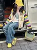 Traje de Niña Otoño e Invierno 2025 Nuevo Conjunto de Dos Piezas de Cardigan de Punto Otoñal para Niña Pantalones de Pierna Ancha de Mezclilla para Niña