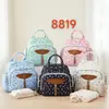 Nueva bolsa de mamá transfronteriza de gran capacidad, aislamiento de papel de aluminio, resistente al agua, bolsa para bebé multipropósito para viajar con niños