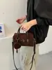 Elegante bolso de bolos de bloques de color de alta calidad para mujer, un bolso de hombro que también se puede llevar cruzado, nuevo bolso tote casual y elegante otoño 2026