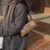 Bolsa baguette de alta qualidade feminina 2026 novo estilo moda textura francesa nicho retrô bolsa de mão bolsa de ombro bolsa de axila