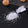 Materiales para manualidades DIY: pétalos de flor de cerezo, lentejuelas, arte de uñas estilo japonés, brillos de resina y relleno de arena líquida