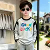Camiseta base de algodón puro para niño, nueva y elegante para primavera y otoño, manga raglán, talla mediana y grande, camiseta de manga larga guapa para niño