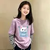 Camiseta de manga larga para niña de algodón puro, nuevo modelo 2026, cuello redondo dulce y lindo, efecto de dos piezas, top versátil para bebés en primavera y otoño