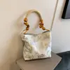 Bolsa de Ombro de Verão Versátil de Luxo Nicho para Mulheres 2024 Nova Bolsa Tote de Mão Estilo Chinês Bolsa de Bambu