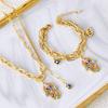 Europeo y americano nuevo color epoxi ojo de palma cadena de suéter acero de titanio pulsera doble capa nicho aretes hebilla collar traje