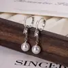 Pendientes de Borla de Diamante Único y Perla Colgantes 2026 Nuevos Pendientes de Diseño de Nicho con un Aspecto Elegante y Versátil