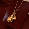 Nuevo collar con colgante de calabaza electrochapada en oro auténtico de estilo chino, estilo nacional, ligero, de lujo, de alta gama, con cadena de lana, joyería combinable para mujer.