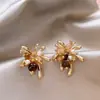 Pendientes Retro Ojo de Tigre Estilo Melanoido Diseño de Nicho Versátiles Pendientes de Botón de Lujo Ligero Moda de Gama Alta para Mujer