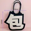 Nova bolsa de feltro criativa para sair, bolsa de ombro de feltro de grande capacidade, bolsa de feltro versátil de nicho abstrato