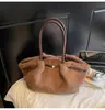 Bolso de Hombro de Peluche Estilo Coreano Simple Tipo Cubo para Mujer Invierno 2025 Nuevo Textura de Alta Gama Estilo Extranjero Bolso de Hombro Único