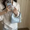 Texturizada de moda para el trabajo y el trayecto diario mujeres 2025 nuevo verano moda lazo un solo hombro axila bolsa de mano bandolera
