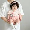 Nuevo mameluco de bebé estilo chino con botones diagonales, colgante de borla y ribete de encaje, mono de algodón de manga corta para bebés