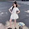Conjunto de Moda de Verano 2026: Conjunto de Dos Piezas: Top Floral Dulce y Fresco de Manga Corta y Falda Elegante de Varios Niveles