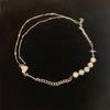 Nuevo collar coreano de perlas reflectantes para mujer, moderno, luminoso, con perlas de colores, con costuras cruzadas y cadena de clavícula.