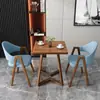 Mesa y sillas de reunión de estilo nórdico, moda italiana, lujo ligero; mesa de recepción y negociación de negocios de alta gama, mesa de ocio para patio