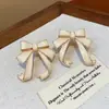 Aretes de Lazo con Goteo de Aceite de Aguja Plateada para Mujer, Aretes Dulces, Delicados y Elegantes con un Toque de Lujo Ligero y de Alta Gama, Presentando un Diseño Único